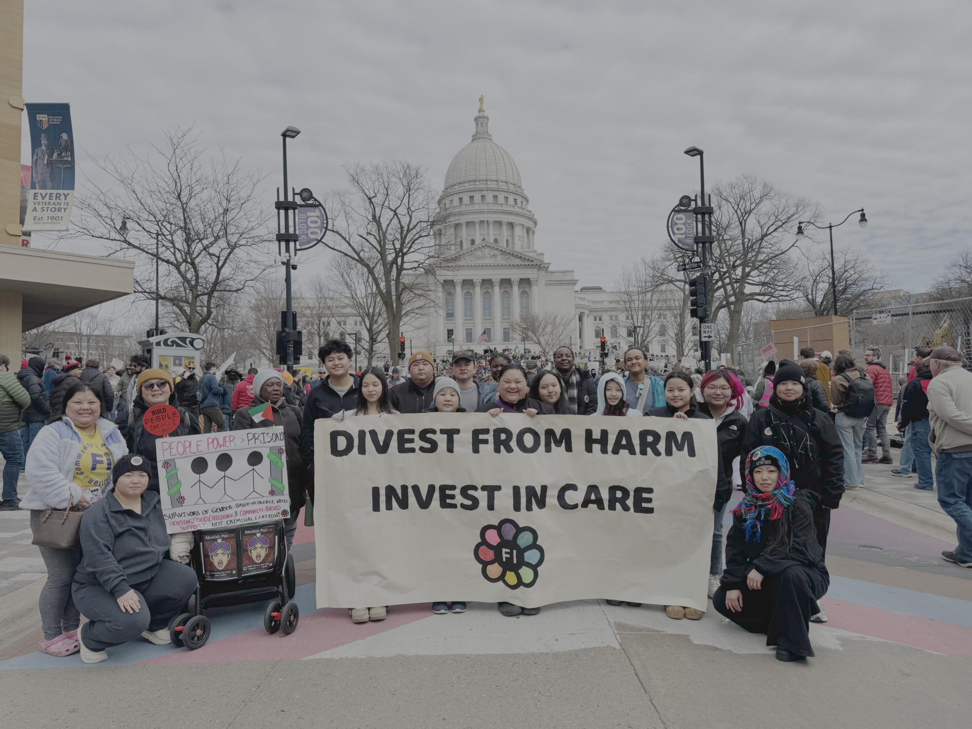 Freedom, Inc staff and volunteers holding a banner in front of the WI capital building